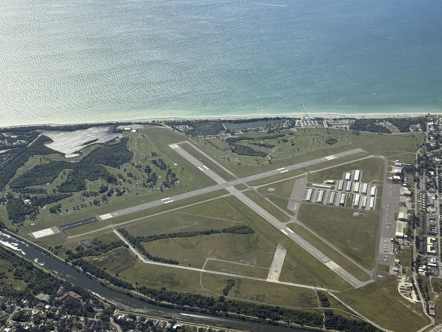 Aerial view of Venice Municipal Airport (KVNC), the flight school near Sarasota, FL on the Gulf Coast